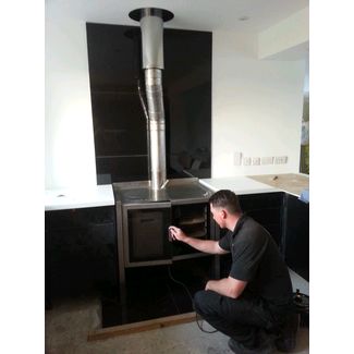 Stainless steel woodburning cooker fitted with a stainless steel flue