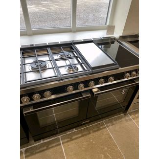 Smeg Portofino 120cm Dual Fuel offering three Gas Burners, Electric Griddle and two-zone Induction Hob